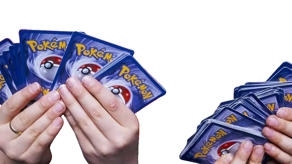 Hands holding Pokemon cards